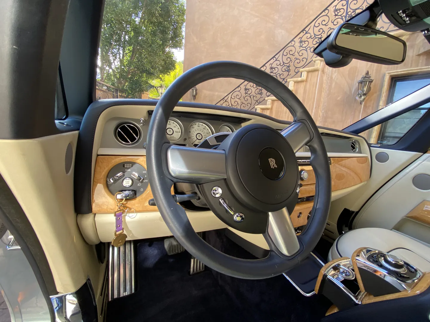 Rolls-Royce interior after detailing, wood steering wheel and cream leather